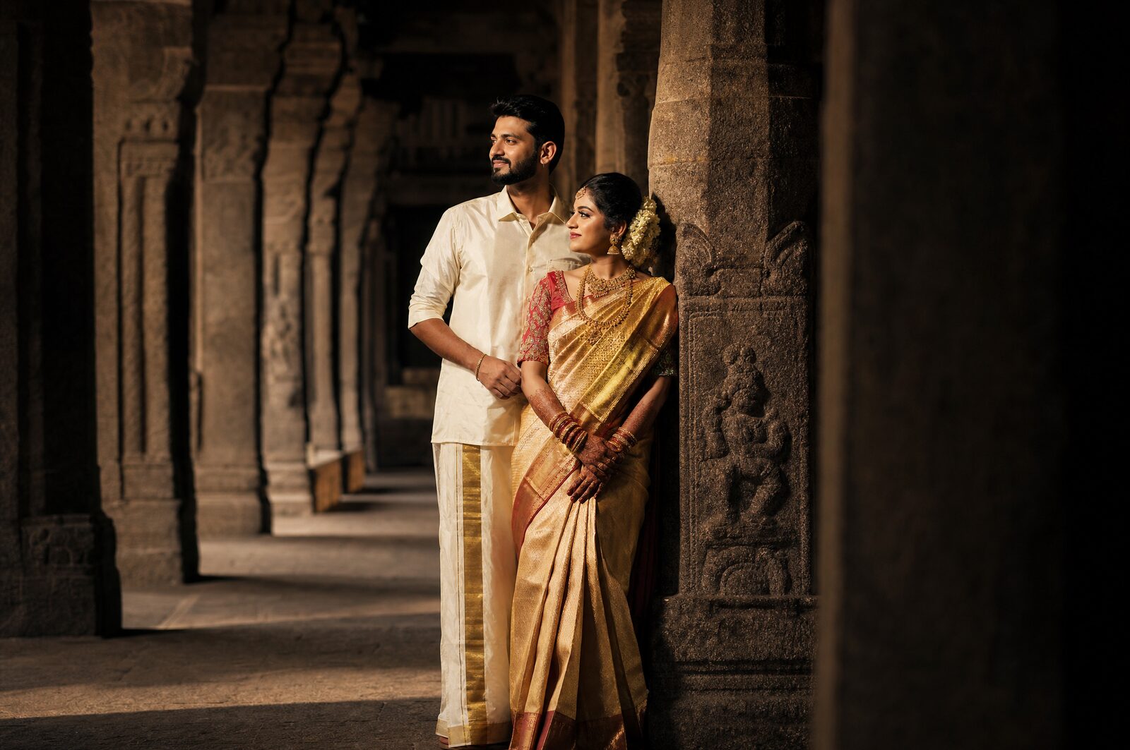A couple in a pillared temple corridor in Chennai